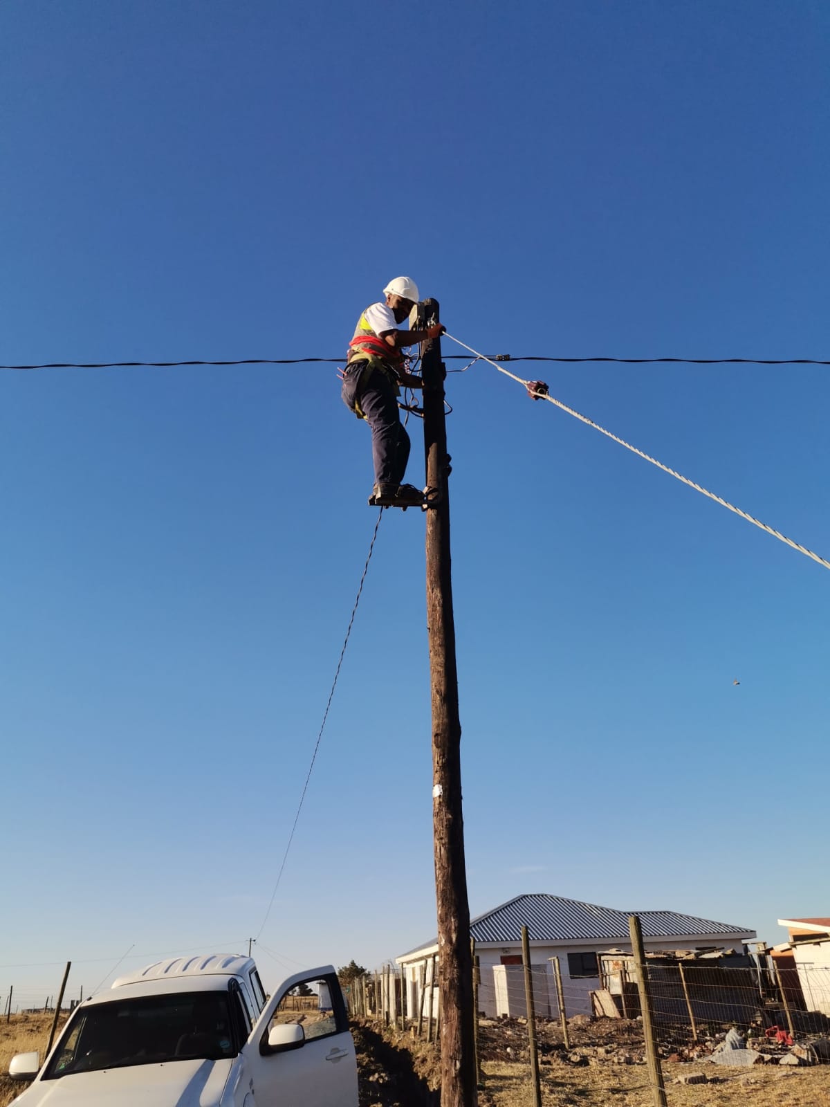 Electrician completing overhead line work